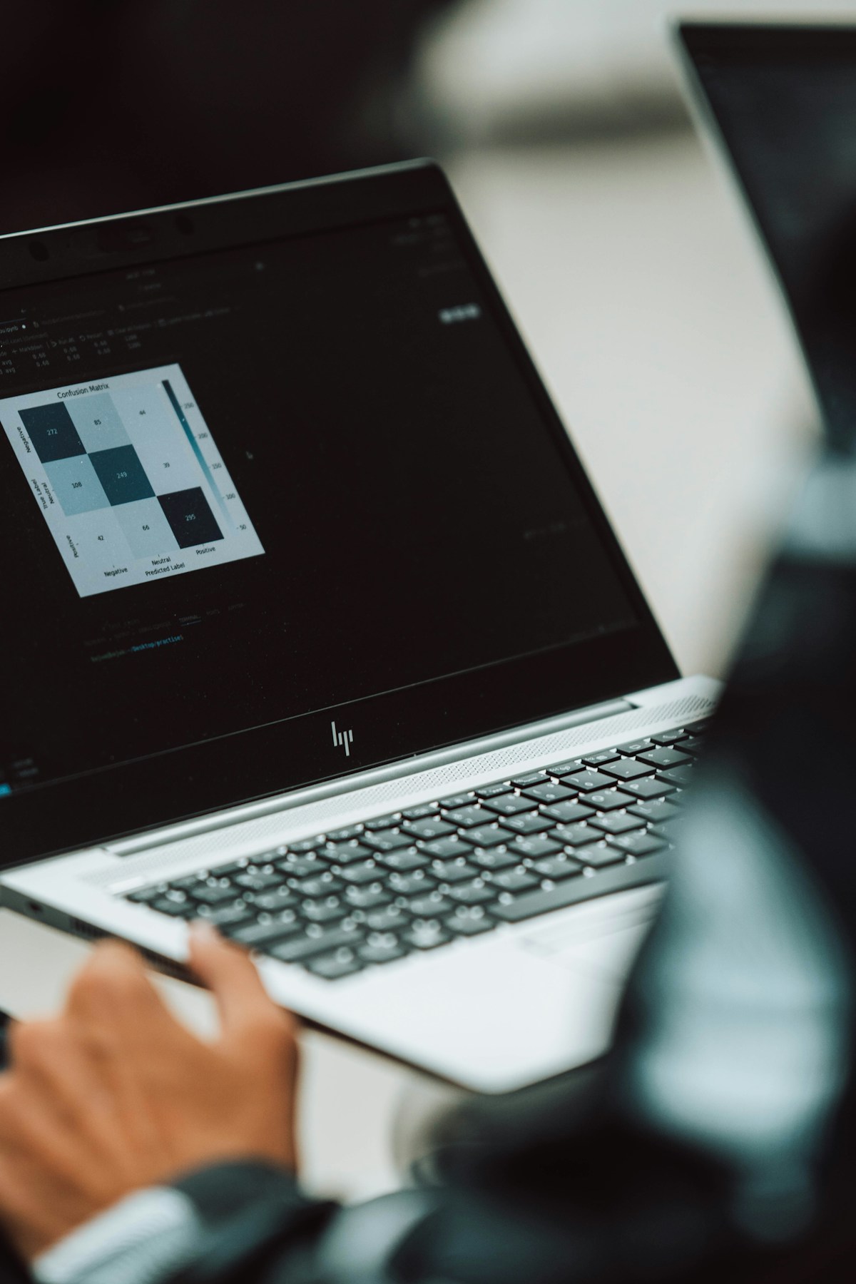 Researcher reviewing data and publication notes on a laptop