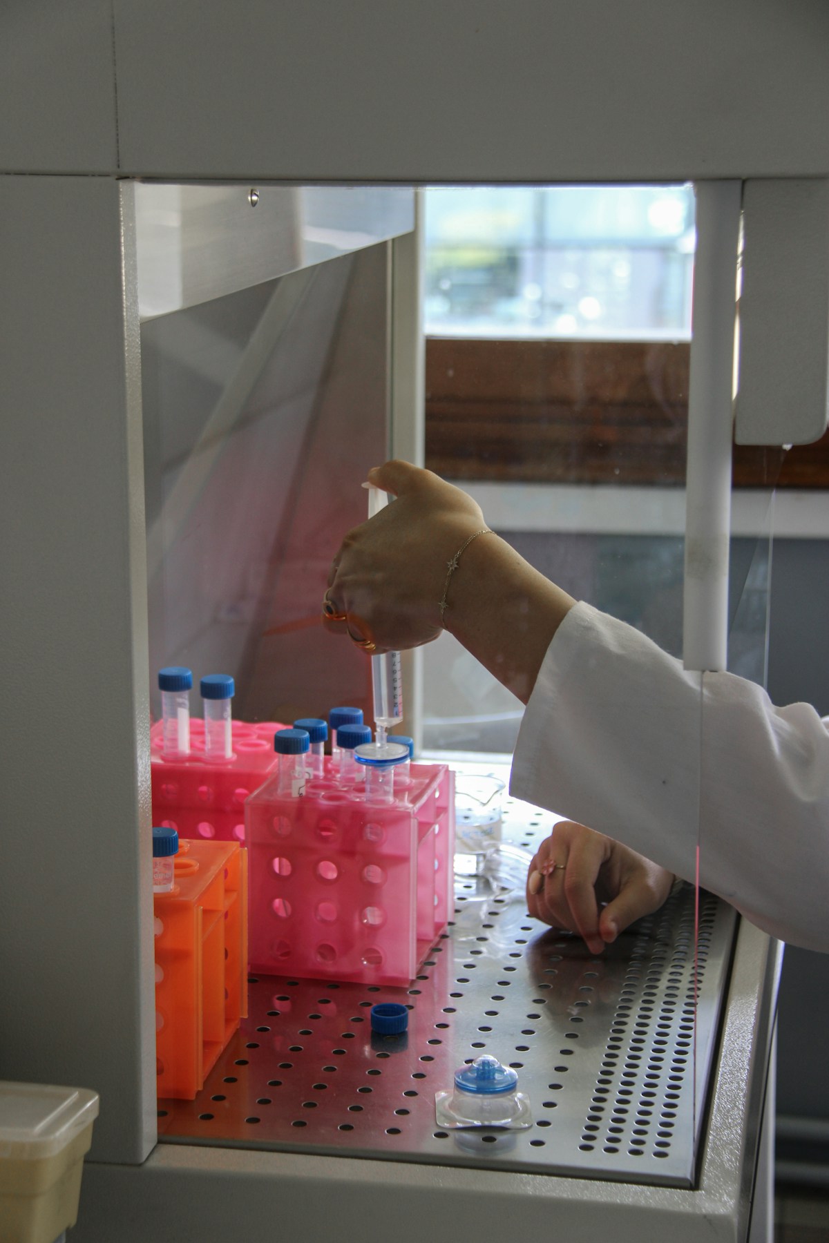Scientist conducting a careful laboratory research experiment